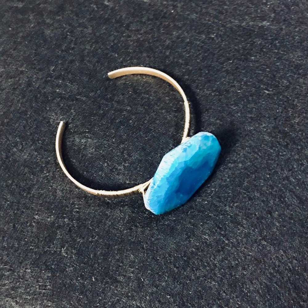 Handmade cuff bracelet with natural cut blue stone